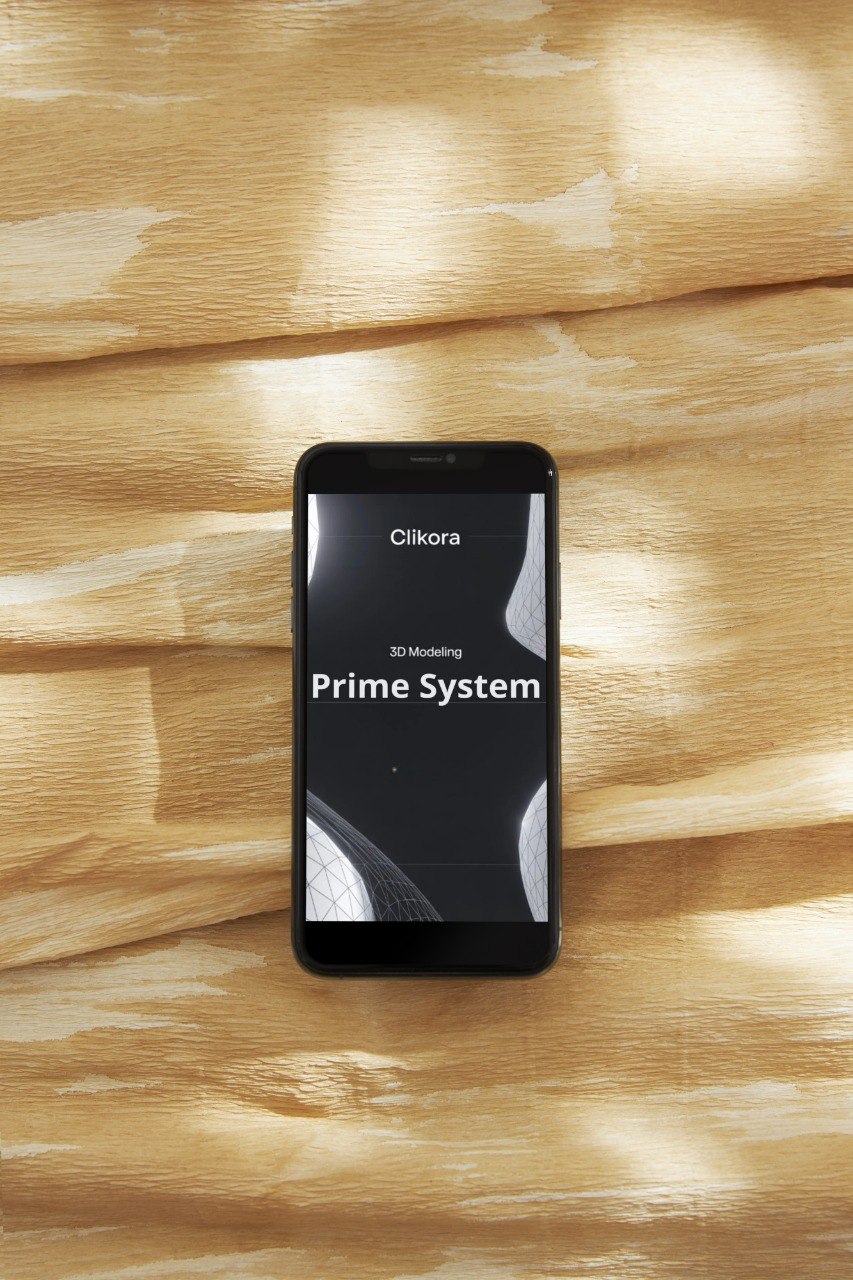 Smartphone displaying a software application interface on a wooden surface